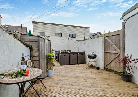 The decked courtyard, barbecue & alfresco dining area at Tolcarne Cottage, Newquay