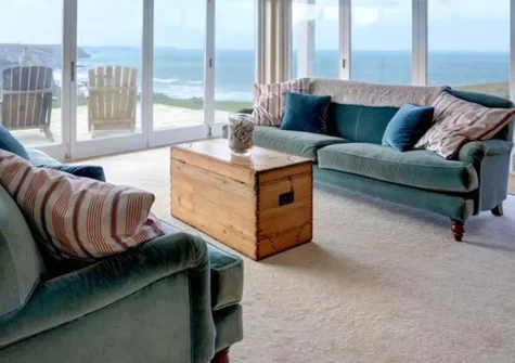 Tonga, Porthtowan is a stunning four-bedroom cliff-top house with sublime sea views, reverse-level design, and spacious outdoor areas including lawn and balcony. Perfect for memorable family holidays exploring Cornwall's Heritage Coast.