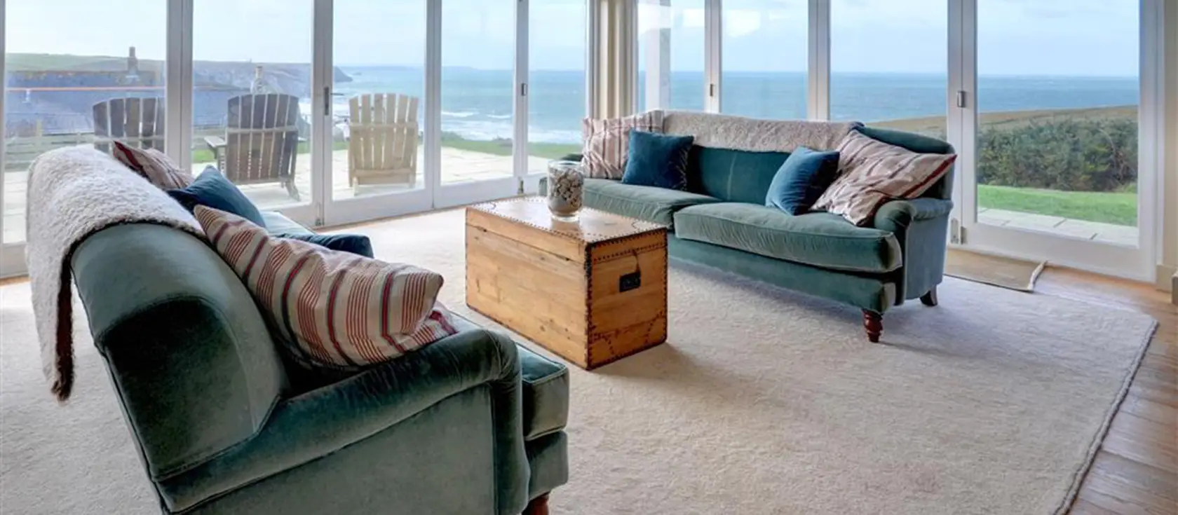 Tonga, Porthtowan is a stunning four-bedroom cliff-top house with sublime sea views, reverse-level design, and spacious outdoor areas including lawn and balcony. Perfect for memorable family holidays exploring Cornwall's Heritage Coast.
