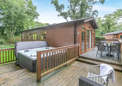 The patio, alfresco dining area & hot tub at Tor Lodge, Meldon Lodge Park, Meldon