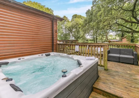 The patio, outdoor sitting area & hot tub at Tor Lodge, Meldon Lodge Park, Meldon