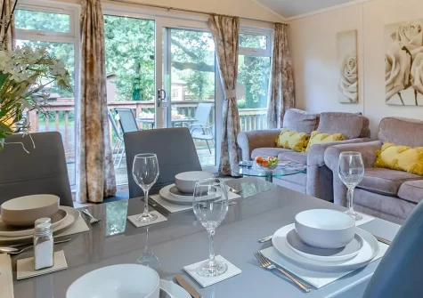 Tor Lodge, Meldon Lodge Park, Meldon is a contemporary detached lodge featuring a private hot tub and decked terrace on Dartmoor's edge. With modern amenities and stunning moorland access, it's perfect for families seeking memorable adventures.