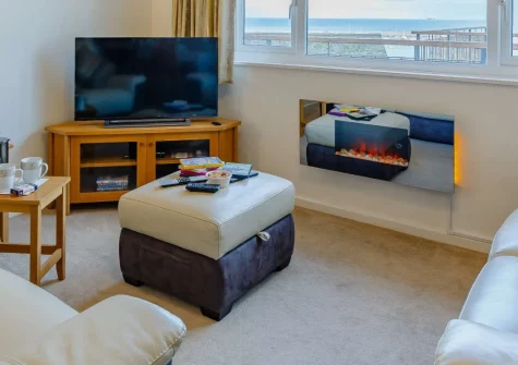 Torbay View at Dolphin Court, Brixham is a bright second-floor apartment just a short stroll from the town's working harbour, offering comfortable modern living, parking, and easy access to coastal paths and the English Riviera's attractions.