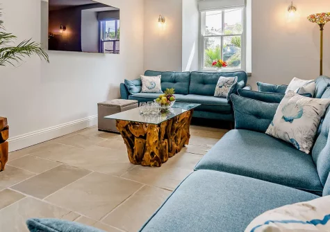 Torre Vean Manor, Porthleven is a stunning Victorian manor with five bedrooms and original features including a turret with stained glass windows. Steps from the village and beach, it's perfect for families seeking unforgettable coastal memories.