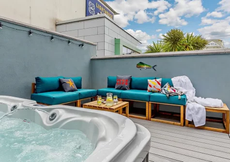 The decked patio, outdoor sitting area & hot tub at Towan House, Newquay