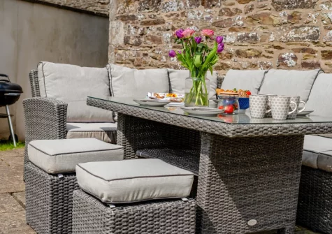 The patio, barbecue & alfresco dining area at Traeth Barn, Mawgan Porth