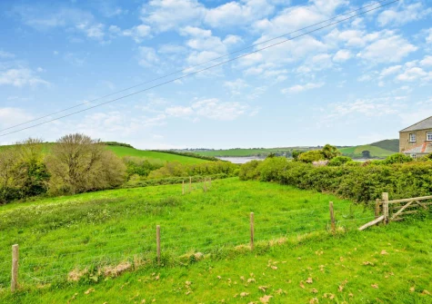 Trailside offers tranquil views across the sandy estuary to Rock