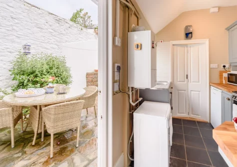 Step out into the enclosed rear courtyard & alfresco dining area at Tranquillity Cottage, Appledore