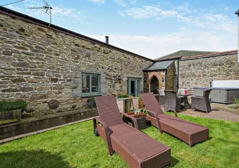 The patio, alfresco dining area & garden at Trebudannon Barn, Trebudannon