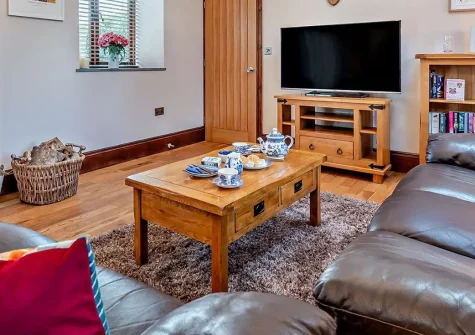 Trebudannon Barn, Trebudannon is a stylish barn conversion with exposed stone walls, private hot tub, and two luxurious bedrooms. Perfectly positioned to explore Cornwall's beaches while enjoying peaceful countryside & and modern comforts.