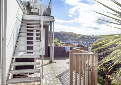 The decked terrace & alfresco dining area at Tree Tops, Kingswear