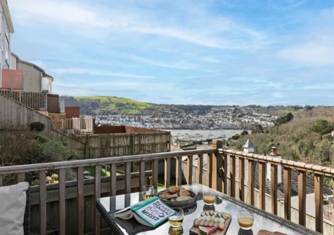 The decked terrace & alfresco dining area at Tree Tops, Kingswear