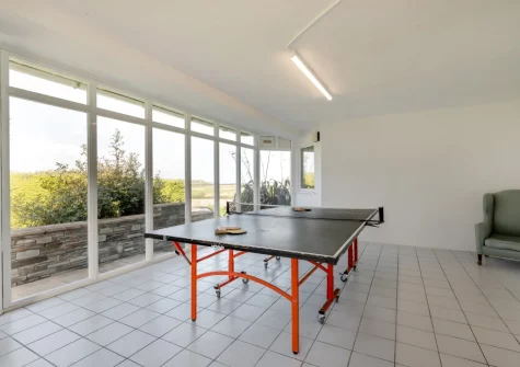 The conservatory with table tennis table at Trefebus, Constantine Bay