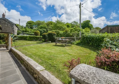 The front private garden & alfresco dining area at Tregenna Farmhouse, Tredethy