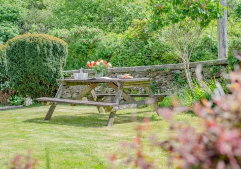 The front private garden & alfresco dining area at Tregenna Farmhouse, Tredethy