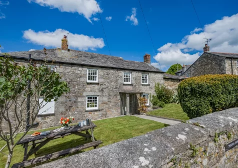 The front private garden & alfresco dining area at Tregenna Farmhouse, Tredethy