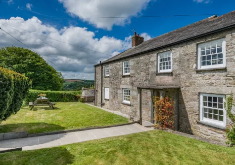 The front private garden & alfresco dining area at Tregenna Farmhouse, Tredethy