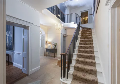 The stairs to the first floor at Treharrock Manor, St Endellion