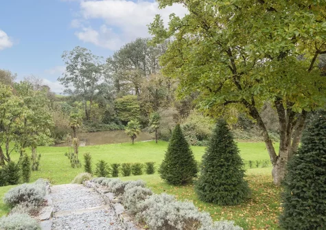 Treharrock Manor, St Endellion is surrounded by lawns, a meadow, a duck pond and sheltered by mature woodland