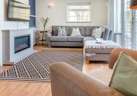 Trelin, Trevone is a contemporary three-bedroom coastal retreat set half a mile from beautiful Trevone Beach, featuring bright open-plan living spaces, dual patio areas, and easy access to Padstow's harbour delights and the stunning Seven Bays.