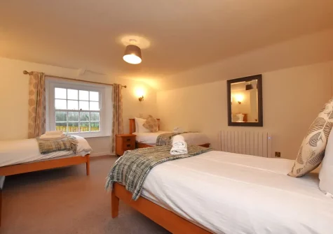 Bedroom #4 at Trelow Farmhouse, Tredinnick