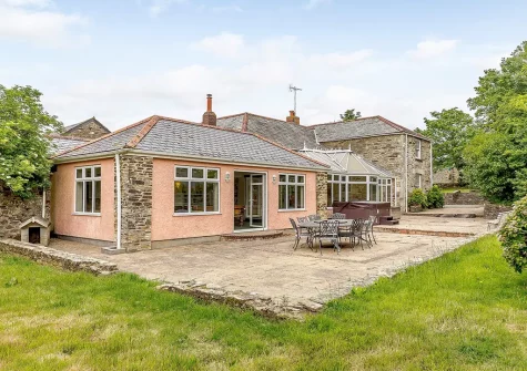 The patio, alfresco dining area & garden at Trelow Farmhouse, Tredinnick
