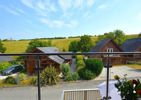 Enjoy countryside views from bedroom #1 balcony & outdoor sitting area at Trenant, Little Petherick