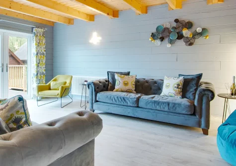 Trenant, Little Petherick is a characterful four-bedroom log home nestled in an Area of Outstanding Natural Beauty, perfect for families and groups seeking countryside charm, multiple entertaining spaces, and easy access to Padstow.