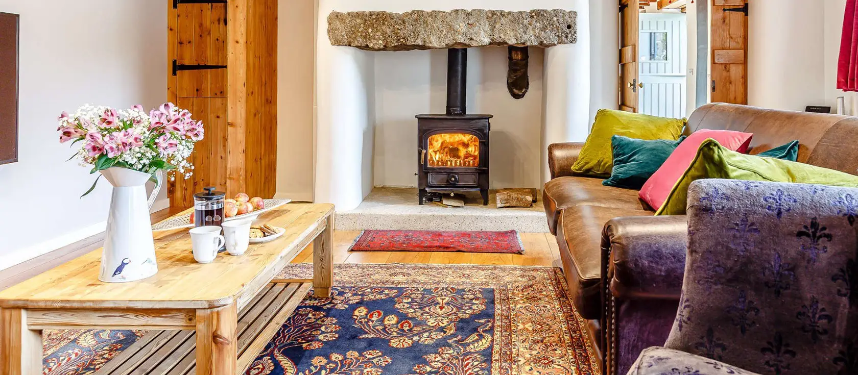 Trenethick Barns, Mount Hawke is a luxurious five-bedroom barn conversion blending rustic charm and modern comfort. With wood burners, a games room and garden, it offers easy access to coastal paths & charming villages for perfect family holidays.