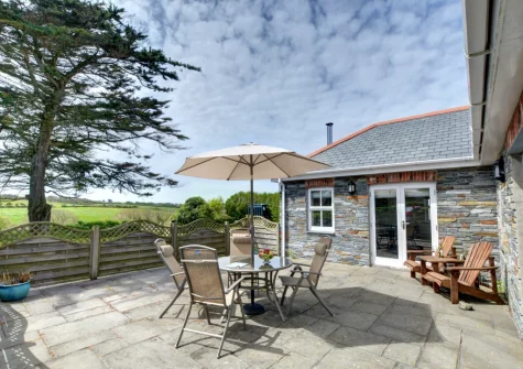 The patio & alfresco dining area at Tresallyn Cottage, St Merryn