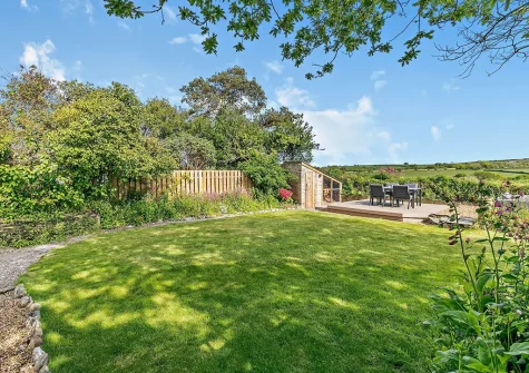 The garden, decked patio & alfresco dining area at Trescore, Treworthal