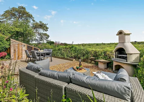 The decked patio, barbecue, alfresco dining & outdoor sitting area at Trescore, Treworthal