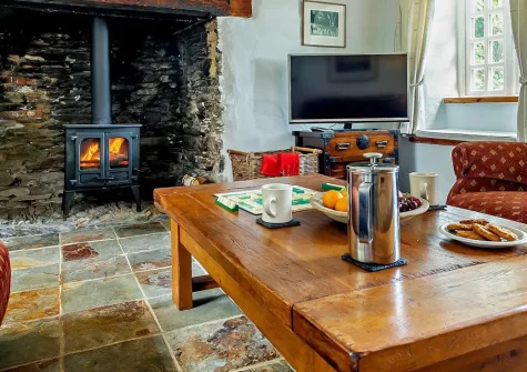 Trescore, Treworthal is a beautifully restored Grade II listed cottage with inglenook fireplace, classic cottage garden, and breathtaking countryside views. Perfect for exploring Cornwall's Roseland Peninsula beaches and charming villages.