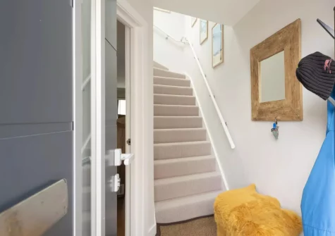 The entrance area & stairs up to the first floor at Treth Nook, Harlyn