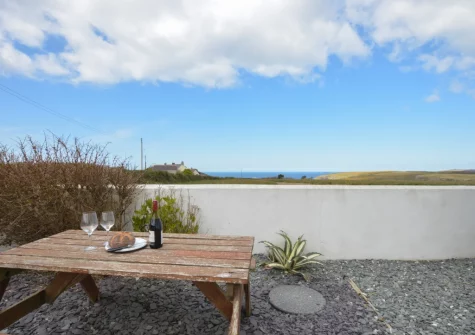 The alfresco dining area at Trevalga, Porthcothan Bay