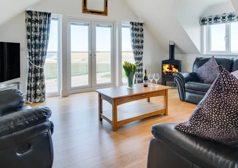 Trevalga, Porthcothan Bay is a spacious six-bedroom coastal retreat perfect for families seeking the ultimate Cornish escape. Savour sea views from your balcony, relax by the wood burner, and enjoy direct access to beautiful Porthcothan Beach.