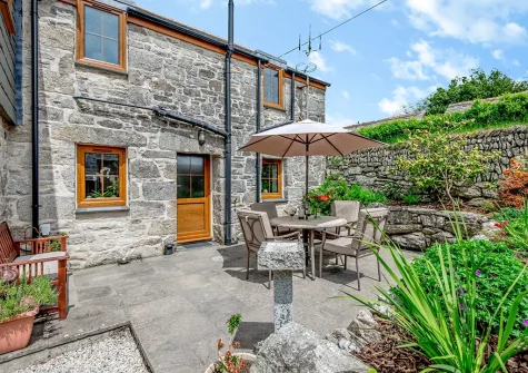 The enclosed patio garden & alfresco dining area at Trevean, St Breward