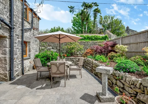 The enclosed patio garden & alfresco dining area at Trevean, St Breward