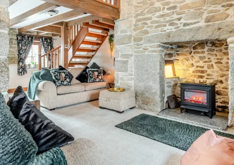 Trevean, St Breward is a beautifully renovated 17th-century granite cottage featuring exposed stone walls and wooden beams. Enjoy a sun-trap south-facing garden, characterful interiors, and easy access to Bodmin Moor and Cornwall's coast.