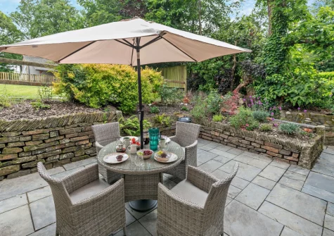 The secluded paved terrace, barbecue & alfresco dining area at Treverran Stables, Fowey