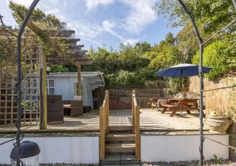 The decked patio, alfresco dining & sitting area at Trevethen Cottage, Crantock