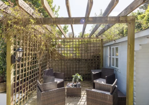 The decked patio & outdoor sitting area at Trevethen Cottage, Crantock