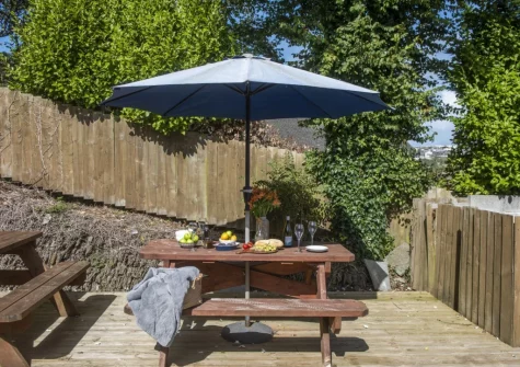 The decked patio & alfresco dining area at Trevethen Cottage, Crantock