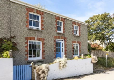 Original floor tiles, parquet flooring & cast-iron fireplaces add to Trevethen Cottage's charm