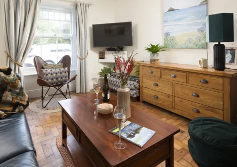 Trevethen Cottage, Crantock is a charming three-bedroom family retreat just 500 metres from Crantock Beach, featuring original period details, a huge raised deck with summerhouse, and outdoor shower, perfect for traditional seaside escapes.