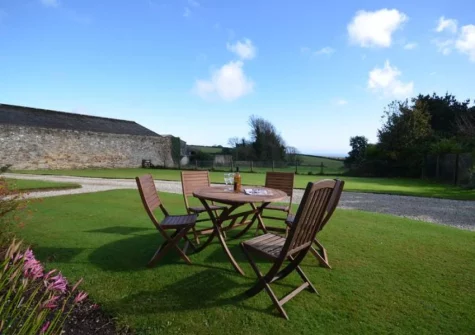 The garden & alfresco dining area at Trevissick, Trenarren