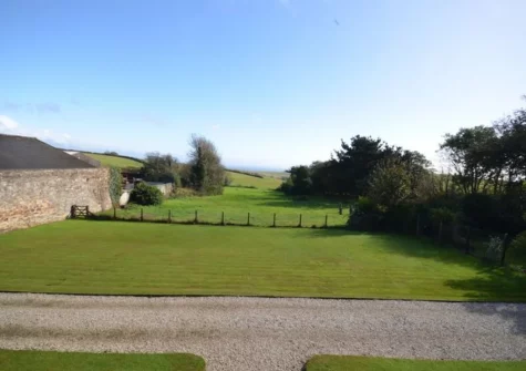 The large enclosed garden, with spectacular sea views, at Trevissick, Trenarren