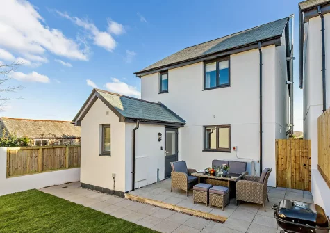 The patio, barbecue, alfresco dining area & garden at Trewhiddle House, St Austell