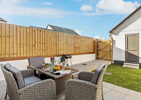 The patio, barbecue, alfresco dining area & garden at Trewhiddle House, St Austell