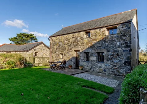 The patio, alfresco dining area & enclosed garden at Trewillis Farm Rose Barn, Coverack